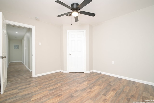 spare room featuring ceiling fan and dark hardwood / wood-style floors