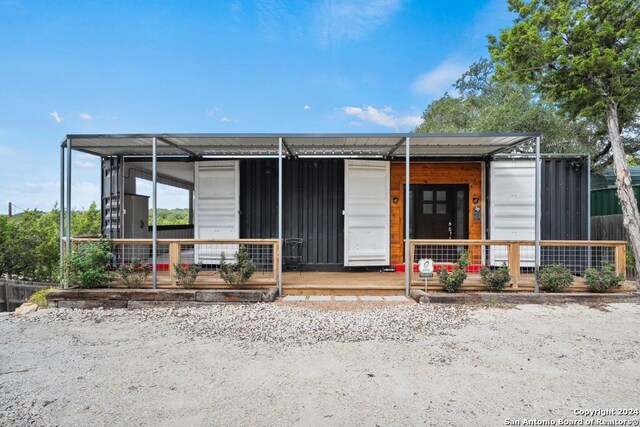 exterior space featuring covered porch