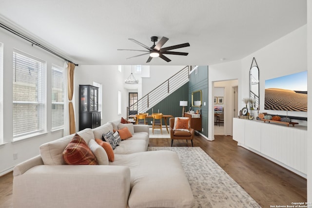 living room with ceiling fan and dark hardwood / wood-style floors