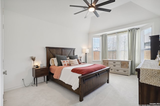 carpeted bedroom featuring ceiling fan and vaulted ceiling