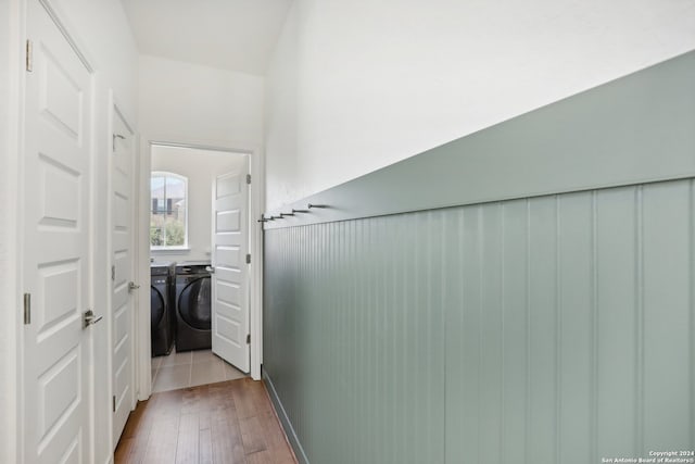 hall featuring separate washer and dryer and light hardwood / wood-style flooring