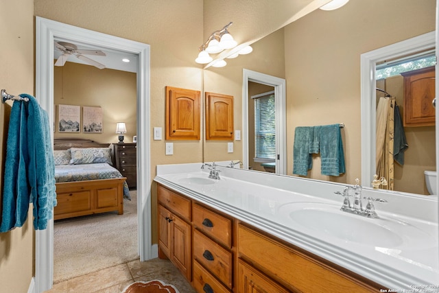 bathroom featuring vanity, tile patterned flooring, toilet, and plenty of natural light