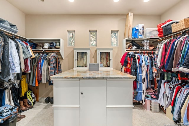 spacious closet with light colored carpet