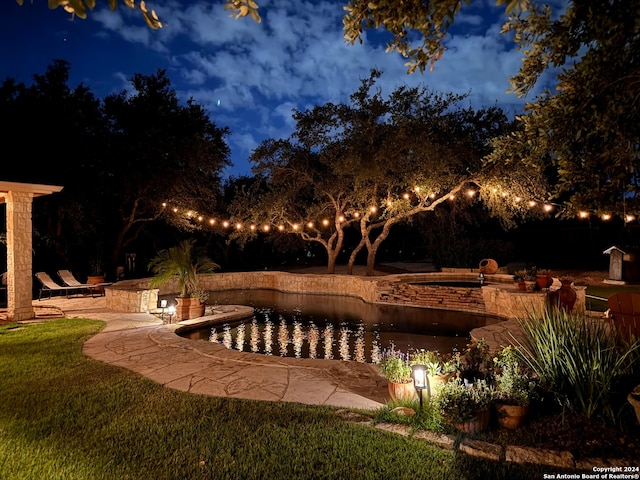 exterior space with a patio and a lawn