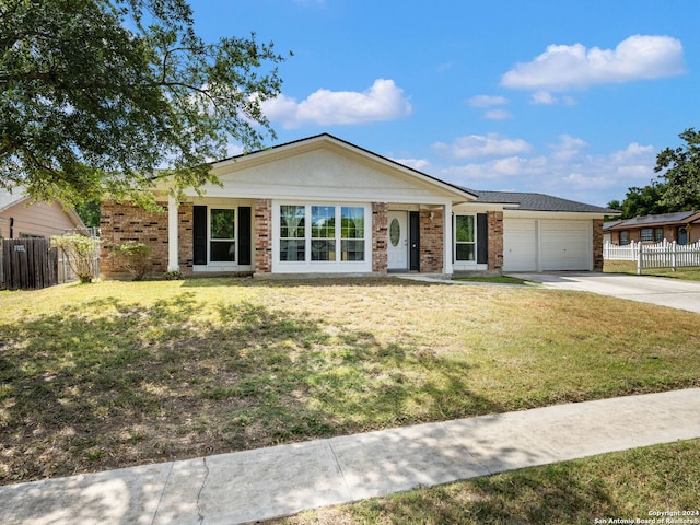 ranch-style house with a garage and a front yard