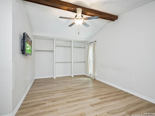 unfurnished bedroom with light wood-type flooring, a textured ceiling, and ceiling fan