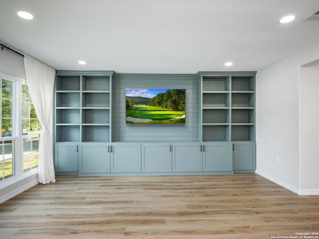 unfurnished living room featuring light wood-type flooring