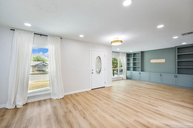 foyer featuring plenty of natural light and light hardwood / wood-style floors