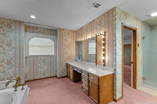 bathroom with independent shower and bath, a wealth of natural light, a textured ceiling, and vanity