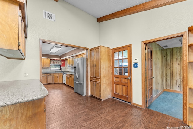 kitchen with stainless steel fridge with ice dispenser, plenty of natural light, white dishwasher, and dark hardwood / wood-style floors