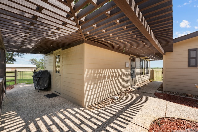 view of patio / terrace featuring grilling area and a pergola