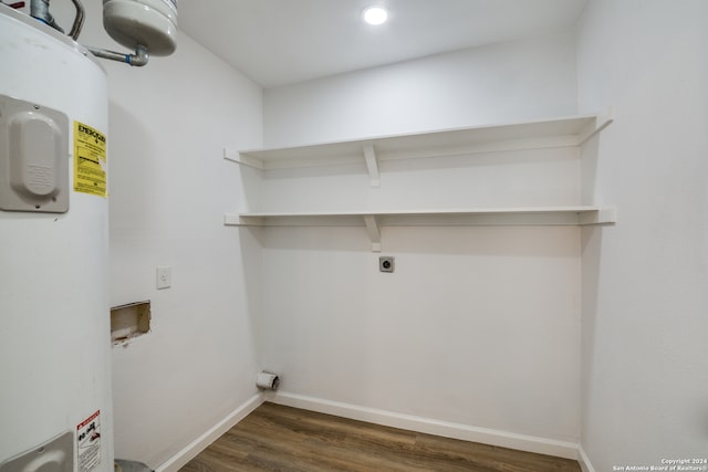 washroom featuring washer hookup, water heater, hookup for an electric dryer, and dark hardwood / wood-style floors