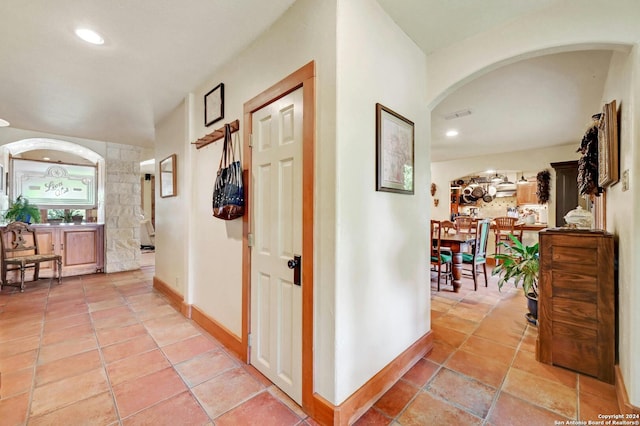 corridor with light tile patterned floors