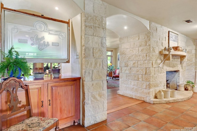 interior space with wood-type flooring and a fireplace