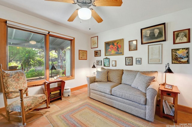 living room with ceiling fan and light tile patterned floors