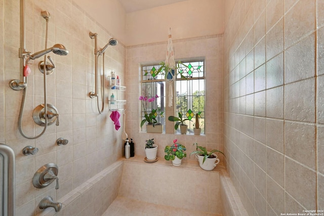 bathroom featuring tiled shower