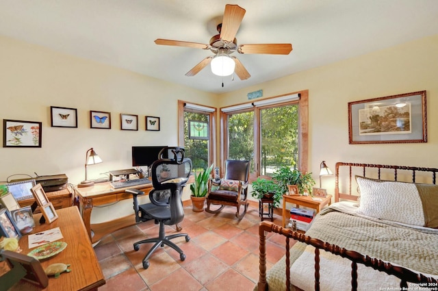 tiled home office with ceiling fan