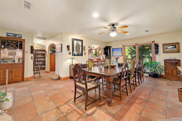 tiled dining room with ceiling fan