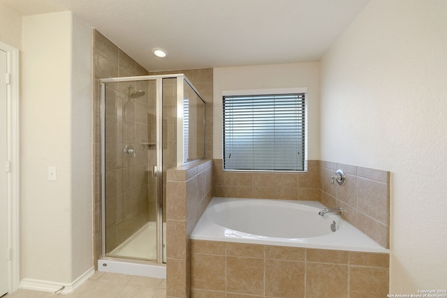 bathroom with tile patterned flooring and plus walk in shower