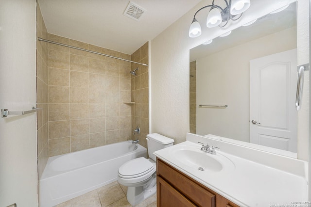 full bathroom featuring toilet, tile patterned flooring, vanity, and tiled shower / bath