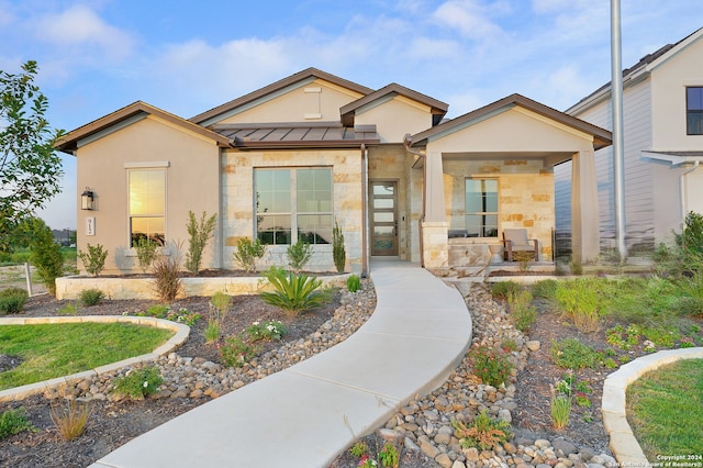 view of front of property featuring covered porch