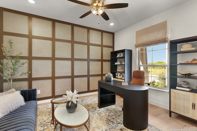 home office with ceiling fan and hardwood / wood-style flooring