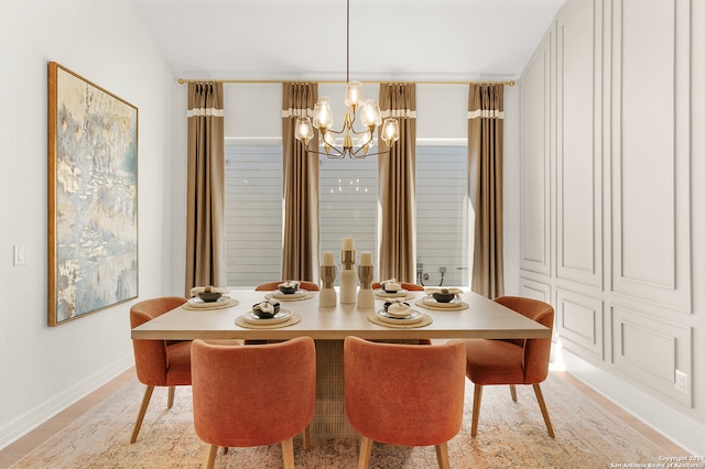 dining space with a chandelier