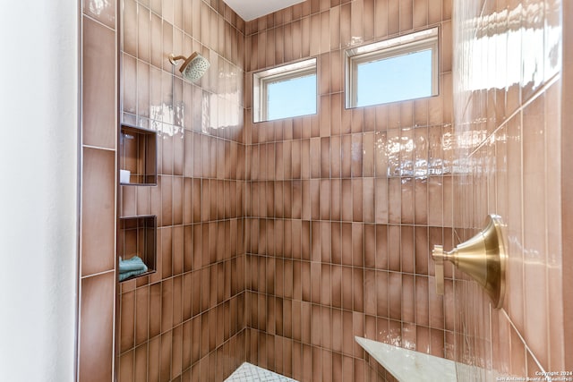 bathroom featuring a tile shower