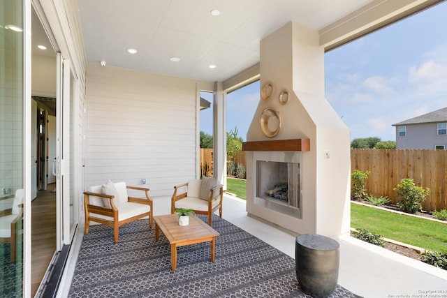 view of patio / terrace featuring an outdoor fireplace