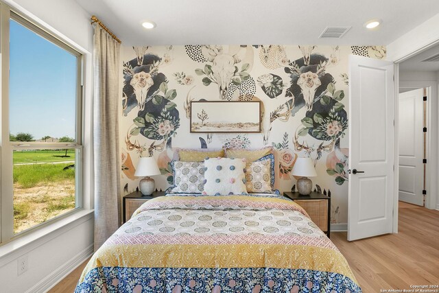 bedroom with light hardwood / wood-style flooring