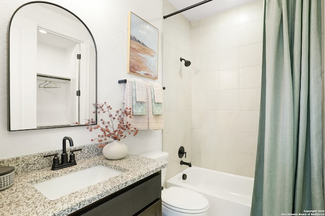 full bathroom featuring toilet, shower / tub combo with curtain, and vanity