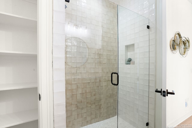 bathroom with an enclosed shower