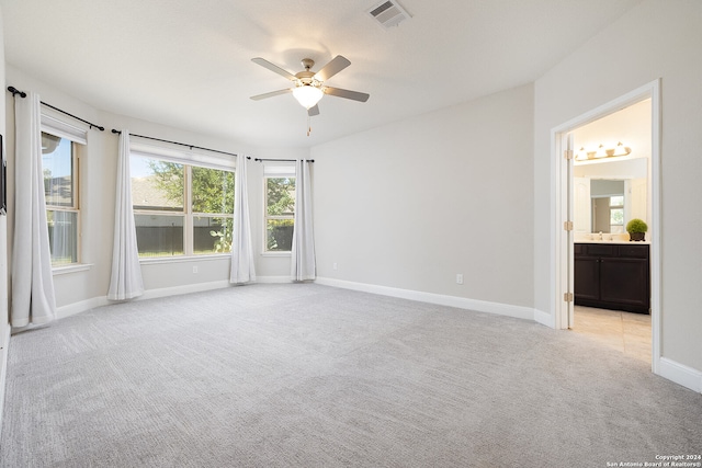 interior space with ceiling fan