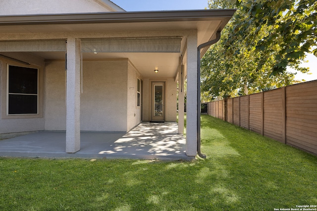 exterior space featuring a lawn and a patio