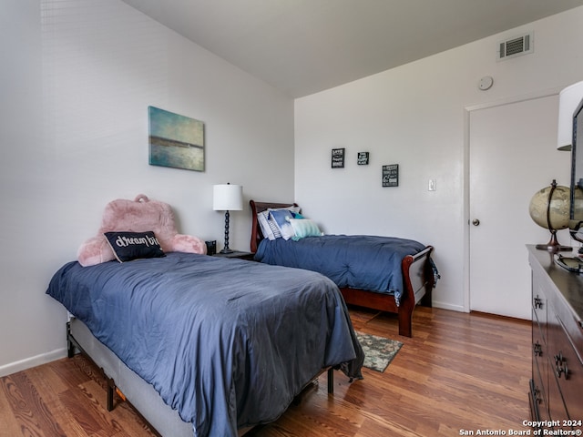 bedroom featuring dark hardwood / wood-style floors