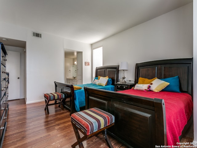 bedroom featuring dark hardwood / wood-style flooring