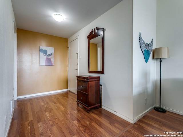 corridor with dark wood-type flooring