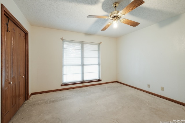 unfurnished bedroom featuring a closet, ceiling fan, and a textured ceiling