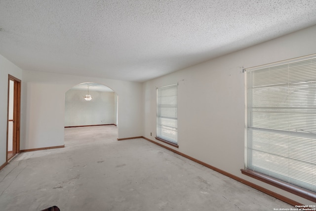 spare room featuring a textured ceiling