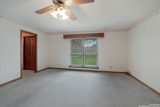 empty room with concrete flooring and ceiling fan