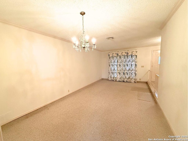 carpeted spare room with an inviting chandelier, ornamental molding, and a textured ceiling