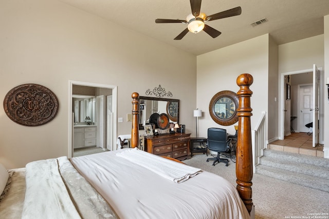 bedroom featuring ceiling fan, light carpet, and ensuite bathroom