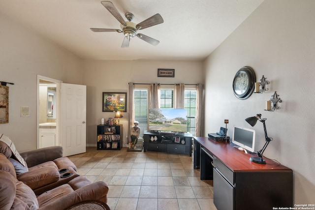 living room featuring light tile patterned flooring and ceiling fan