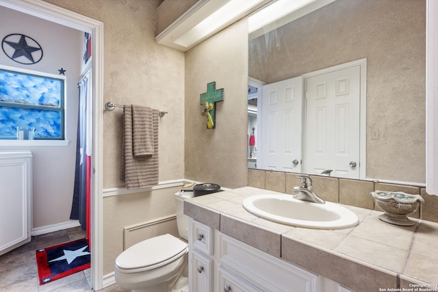 bathroom with vanity and toilet