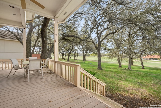 wooden terrace with a lawn