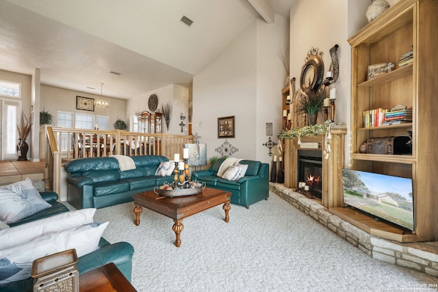 carpeted living room featuring a notable chandelier, a stone fireplace, high vaulted ceiling, and beam ceiling