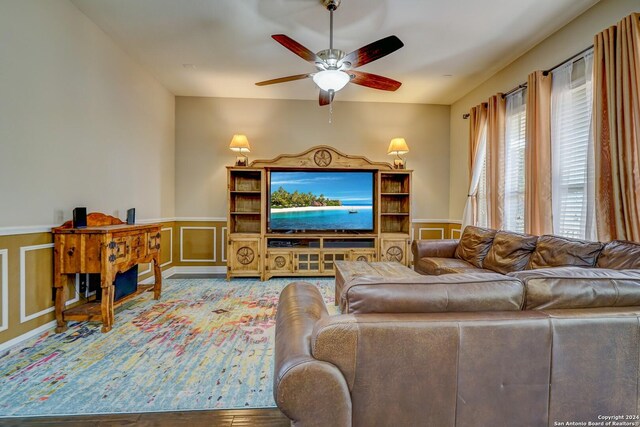 living room with hardwood / wood-style floors and ceiling fan