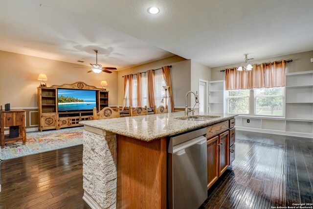 kitchen featuring stainless steel dishwasher, sink, hanging light fixtures, and dark hardwood / wood-style flooring