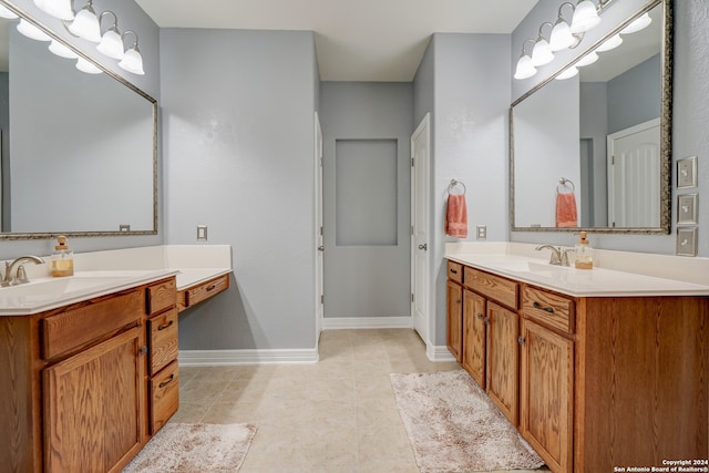 bathroom with tile patterned flooring and vanity