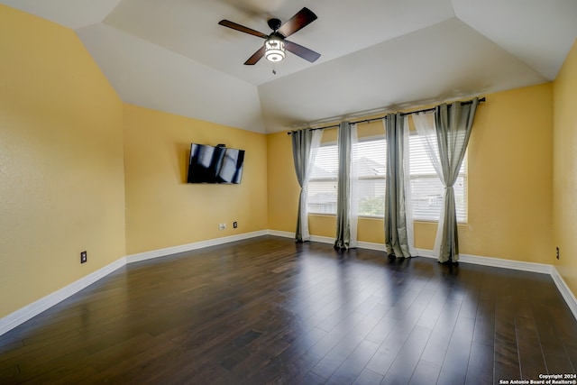 spare room with lofted ceiling, ceiling fan, and dark hardwood / wood-style flooring